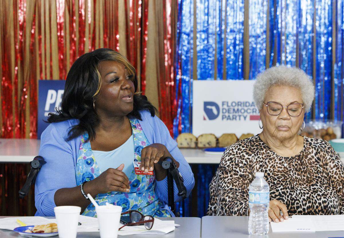 Sardeborah Wright, state legislative chair for NARFE, left, speaks to Michigan Gov. Gretchen Whitmer during a labor roundtable with the Florida Democratic Party on Monday, Oct. 20, 2025, at the United Teachers of Dade office building in Miami, Fla.