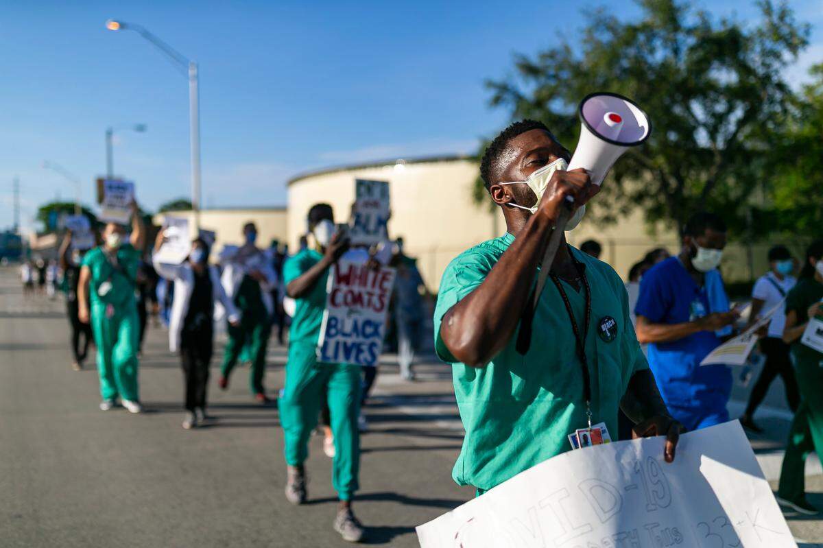 Dr. Anthony Okafor, 28, participates in a White Coats for Black Lives rally near Jackson Memorial Hospital in Miami, Florida on Tuesday, June 9, 2020.