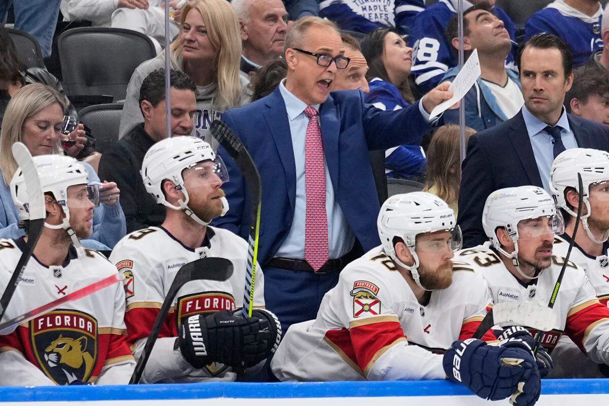 May 18, 2025; Toronto, Ontario, CAN; Florida Panthers head coach Paul Maurice (blue suit) calls out instructions during the third period of game seven of the second round of the 2025 Stanley Cup Playoffs against the Toronto Maple Leafs at Scotiabank Arena. Mandatory Credit: John E. Sokolowski-Imagn Images
