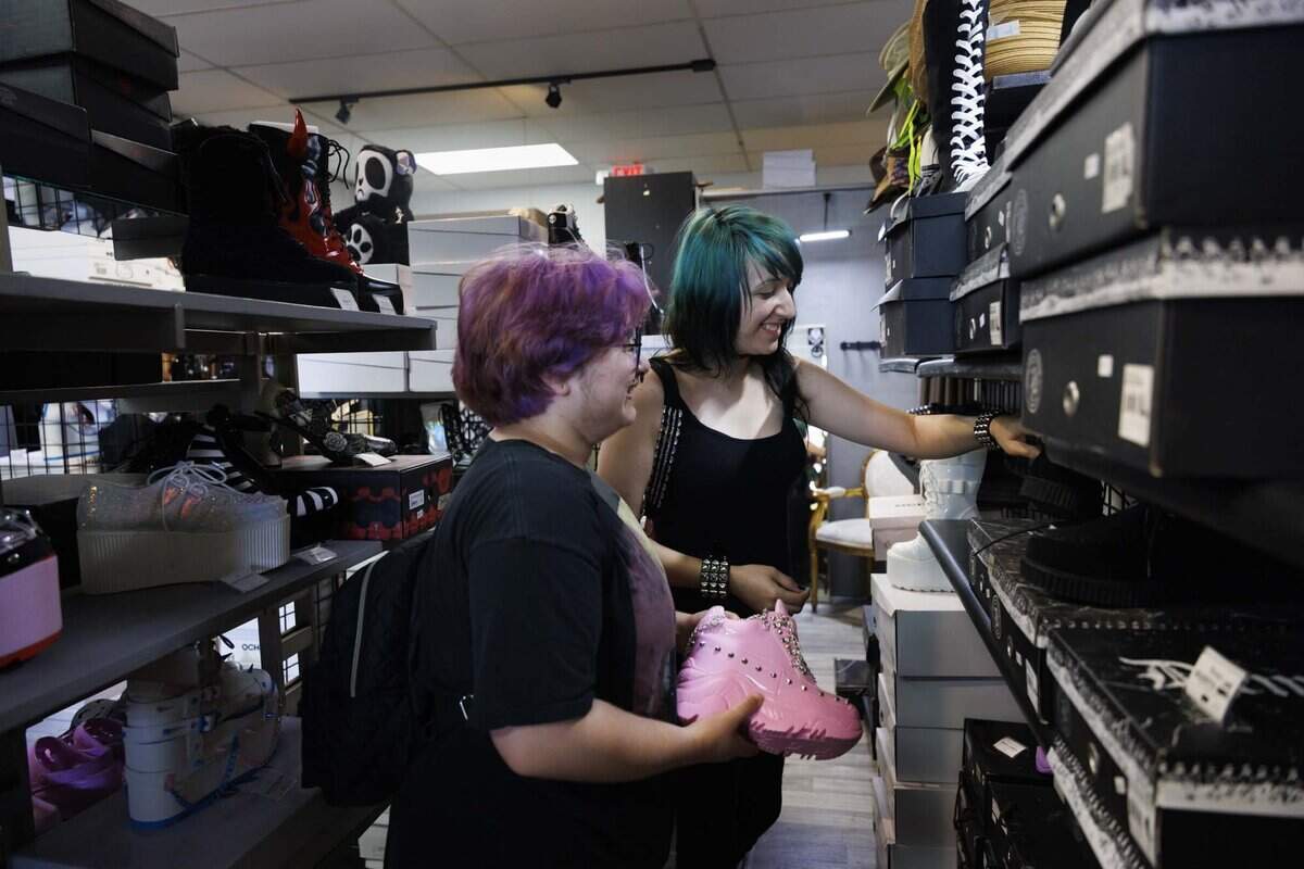 Jayden Hernandez, left, and Melanie Dediego shop at Freak House, an alternative clothing store, on Thursday, June 18, 2026, on S Dixie Hwy in Miami, Fla. Freak House, owned and operated by James and Ana Jones, is closing its doors next Friday. “There's no shops like this here in Miami, Tampa is the closest one,” said Hernandez.