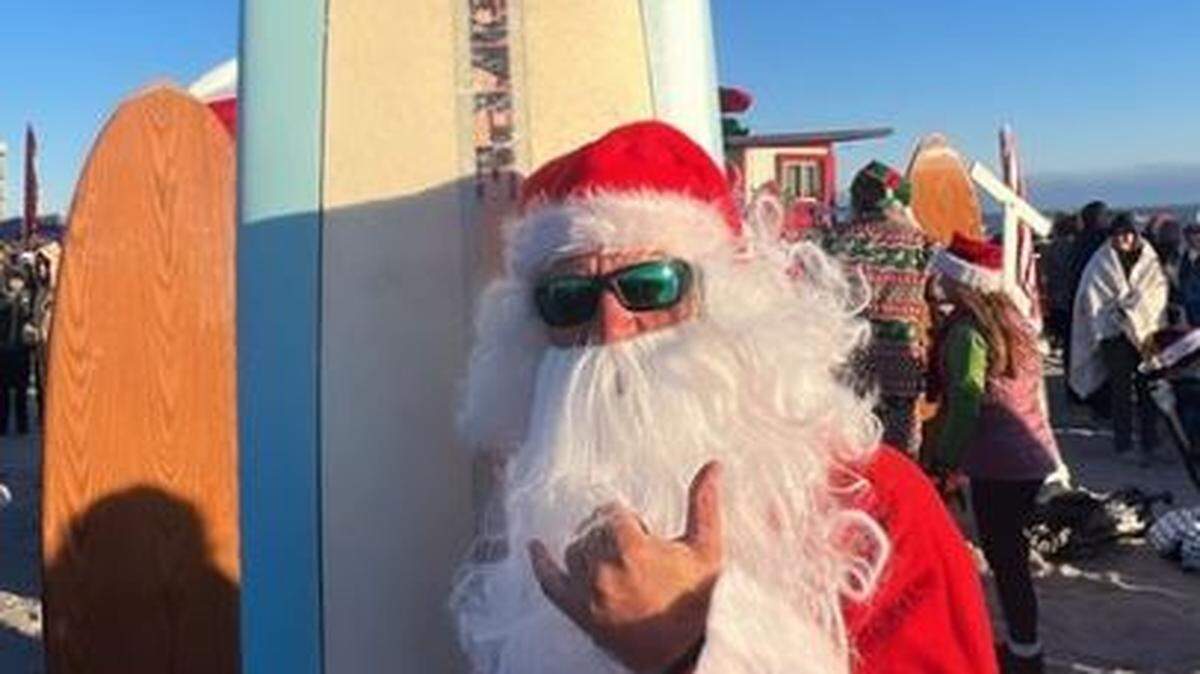 The Surfing Santas of Cocoa Beach, Florida, did their thing on Saturday morning despite the cold.