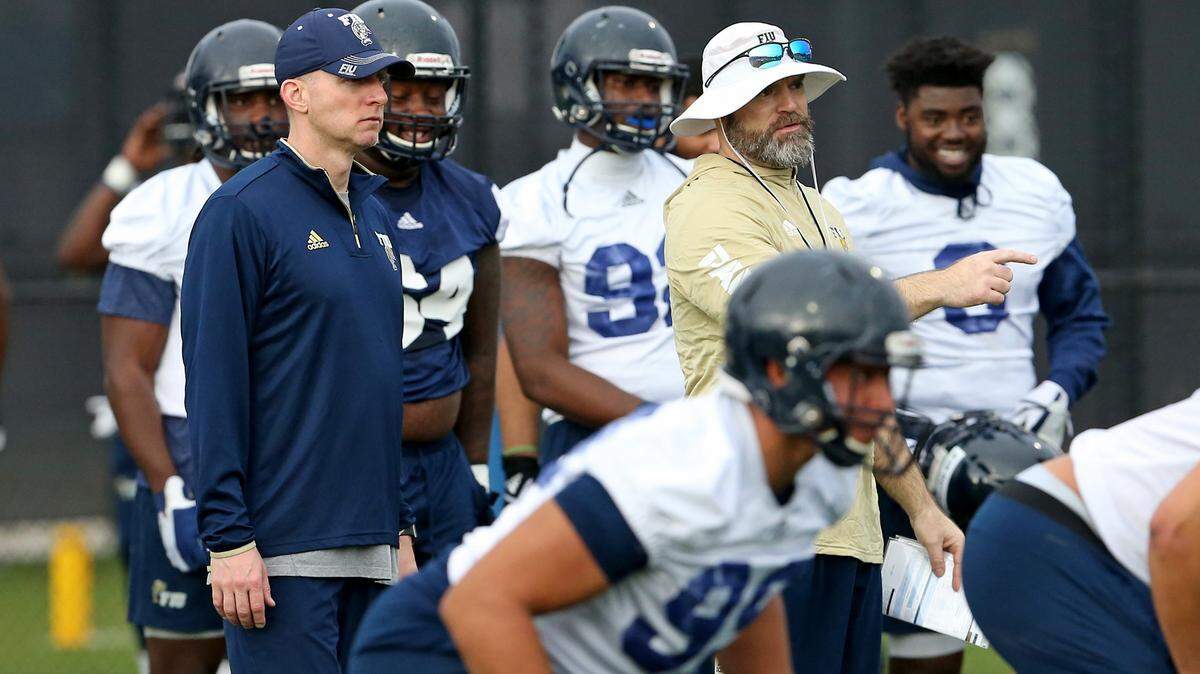 FIU Panthers assistant coaches Jerod Kruse, left,  and Jeff Copp look during spring football practice at Florida International University on Wednesday, March 20, 2019 in Miami.