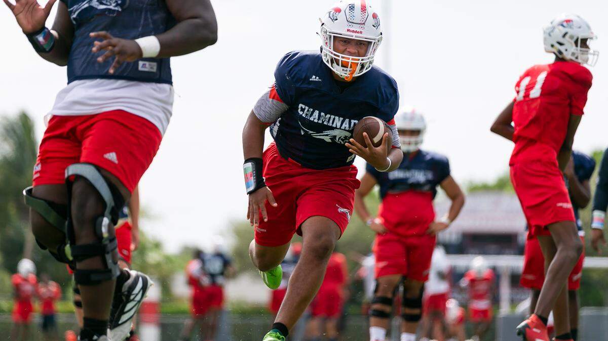 Chaminade-Madonna players run drills during a football practice at their school’s field in Hollywood, Florida on Wednesday, August 25, 2021.