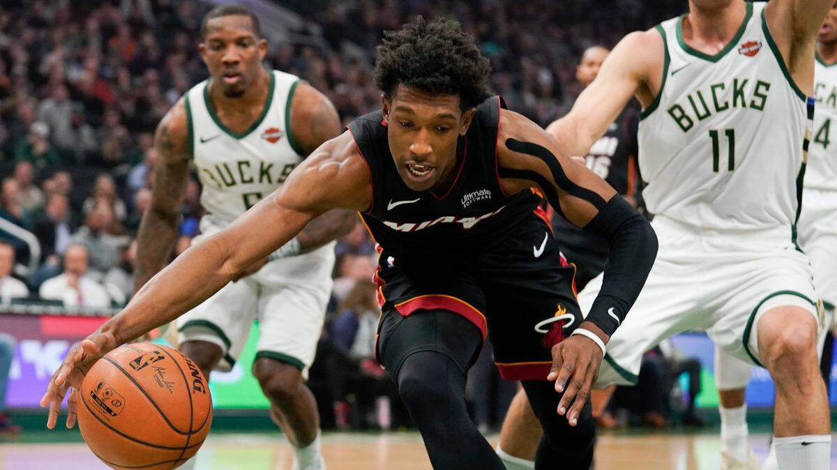 Miami Heat’s Josh Richardson goes after a loose ball during the first half of an NBA basketball game against the Milwaukee Bucks Tuesday, Jan. 15, 2019, in Milwaukee. (AP Photo/Morry Gash)