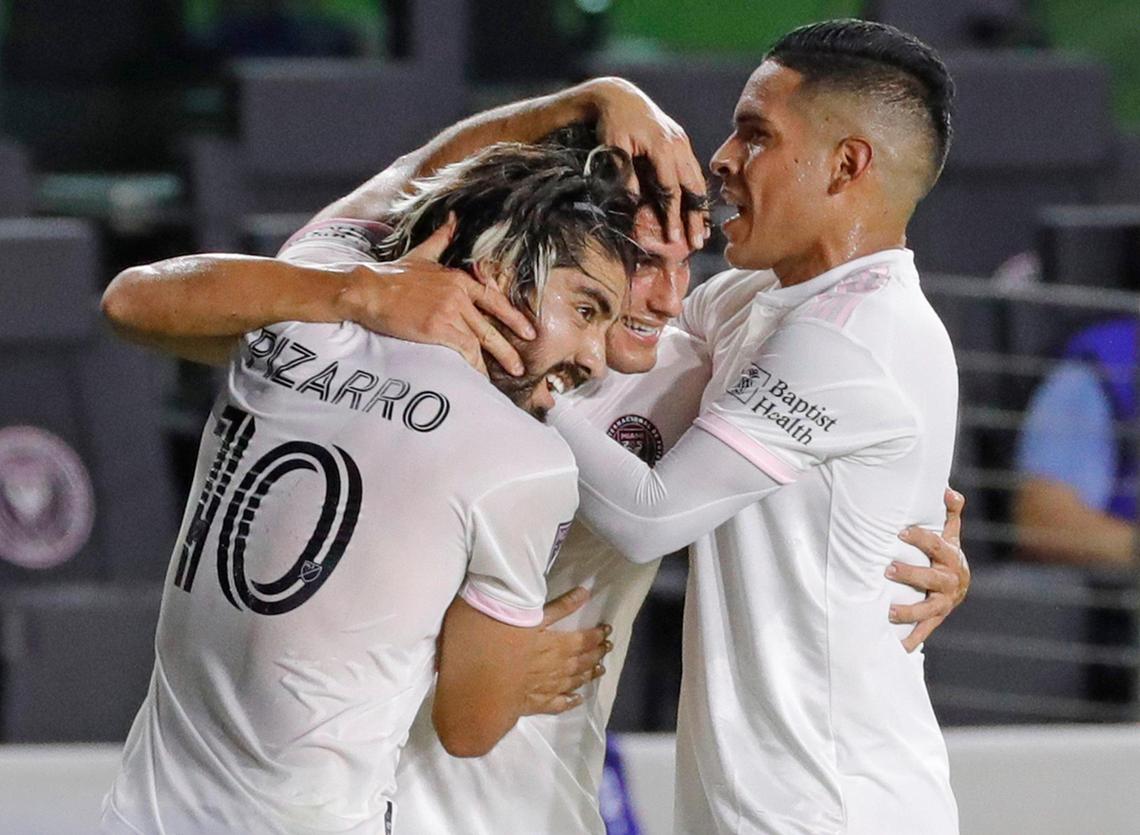 Inter Miami midfielder Rodolfo Pizarro (10), forward Julian Carranza (21) and midfielder Victor Ulloa (13) celebrate on the field after Carranza scores a goal in the first half as the Inter Miami CF hosts Orlando City at Inter Miami CF Stadium in Fort Lauderdale on Saturday, August 22, 2020.
