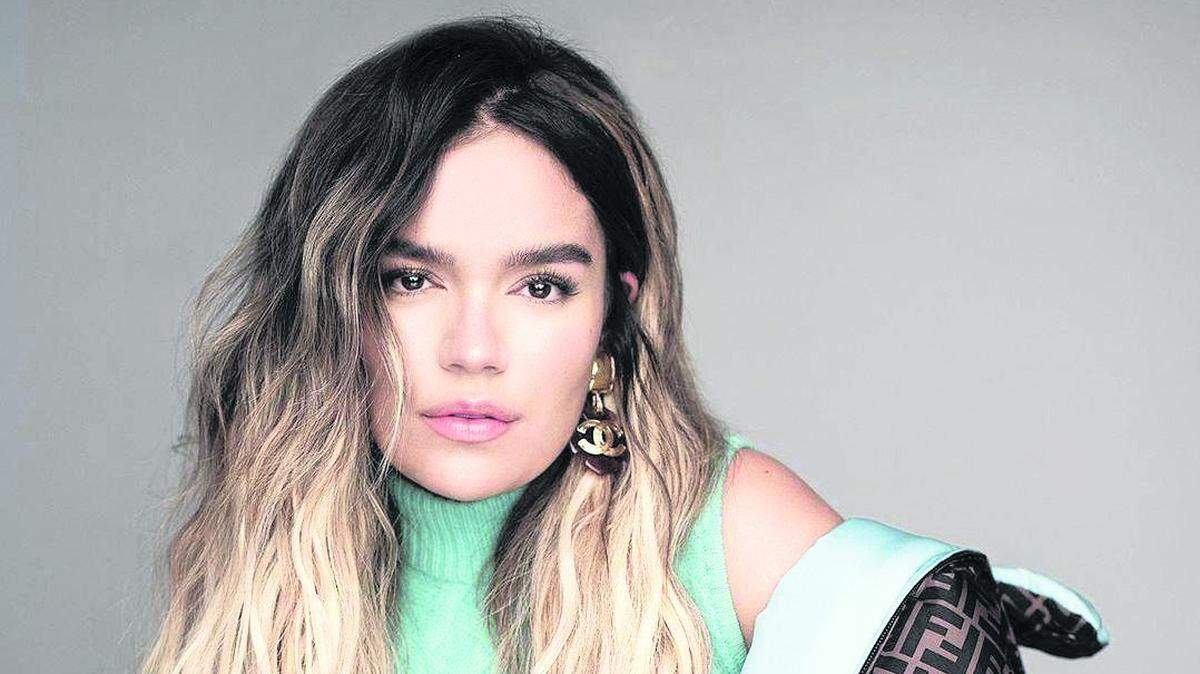 International Colombian singer Karol G tumbled down a stage while performing at the FTX Arena on Friday. The fall and artist is trending on social media.