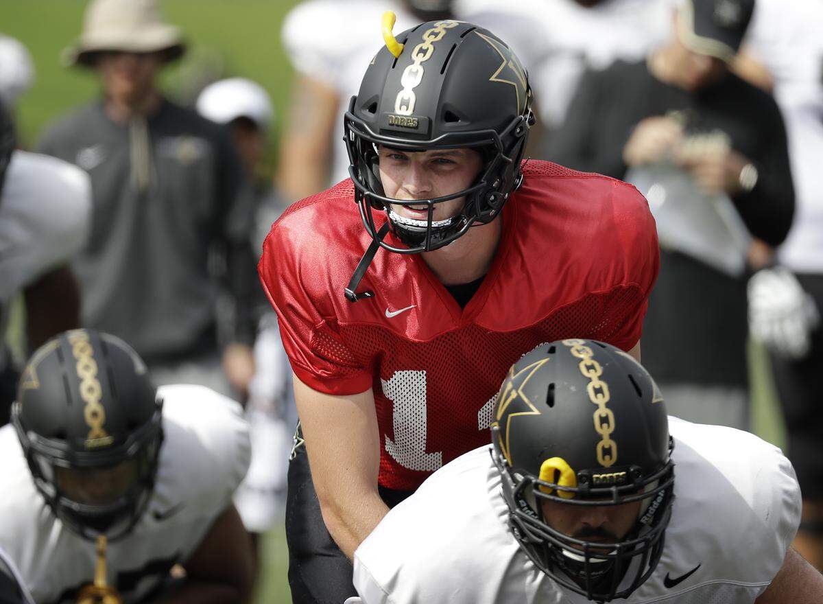 In this Aug. 15, 2018, photo, Vanderbilt senior quarterback Kyle Shurmur runs a drill during an NCAA college football practice in Nashville, Tenn. The Commodores are hoping to improve on last season’s 5-7 record that began with a three-game win streak but was dimmed by a five-game skid that included a 59-0 loss to eventual national champ Alabama. (AP Photo/Mark Humphrey)