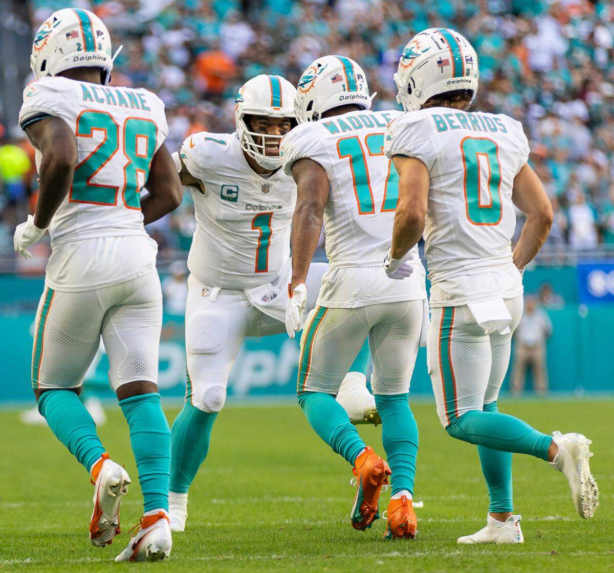 Miami Dolphins wide receiver Jaylen Waddle (17) celebrates with quarterback Tua Tagovailoa (1) after scoring a touchdown against the New York Jets in the second quarter of an NFL game at Hard Rock Stadium on Sunday, Dec. 17, 2023, in Miami Gardens, Fla.