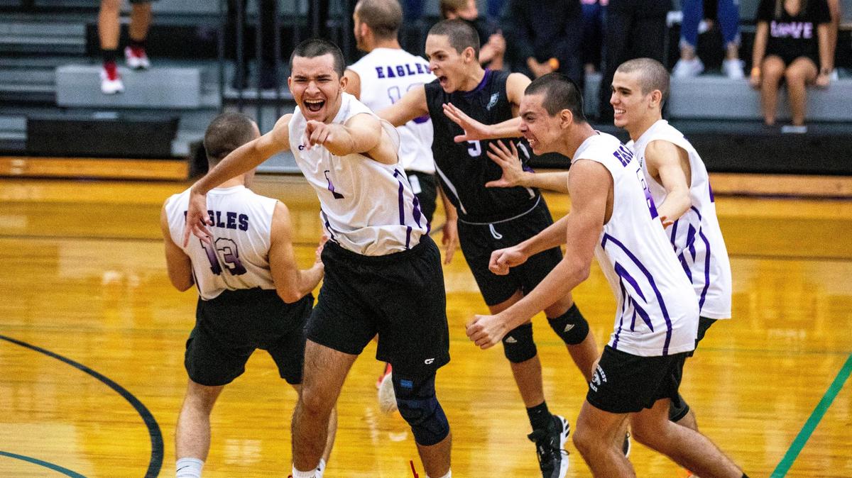 Southwest Miami Senior High School boy’s volleyball team react to defeating Forest High School in five sets during the 2021 FHSAA Boys Volleyball Quarterfinals #4 against at Archbishop McCarthy High School in Cooper City, Florida, on Friday, May 14, 2021.