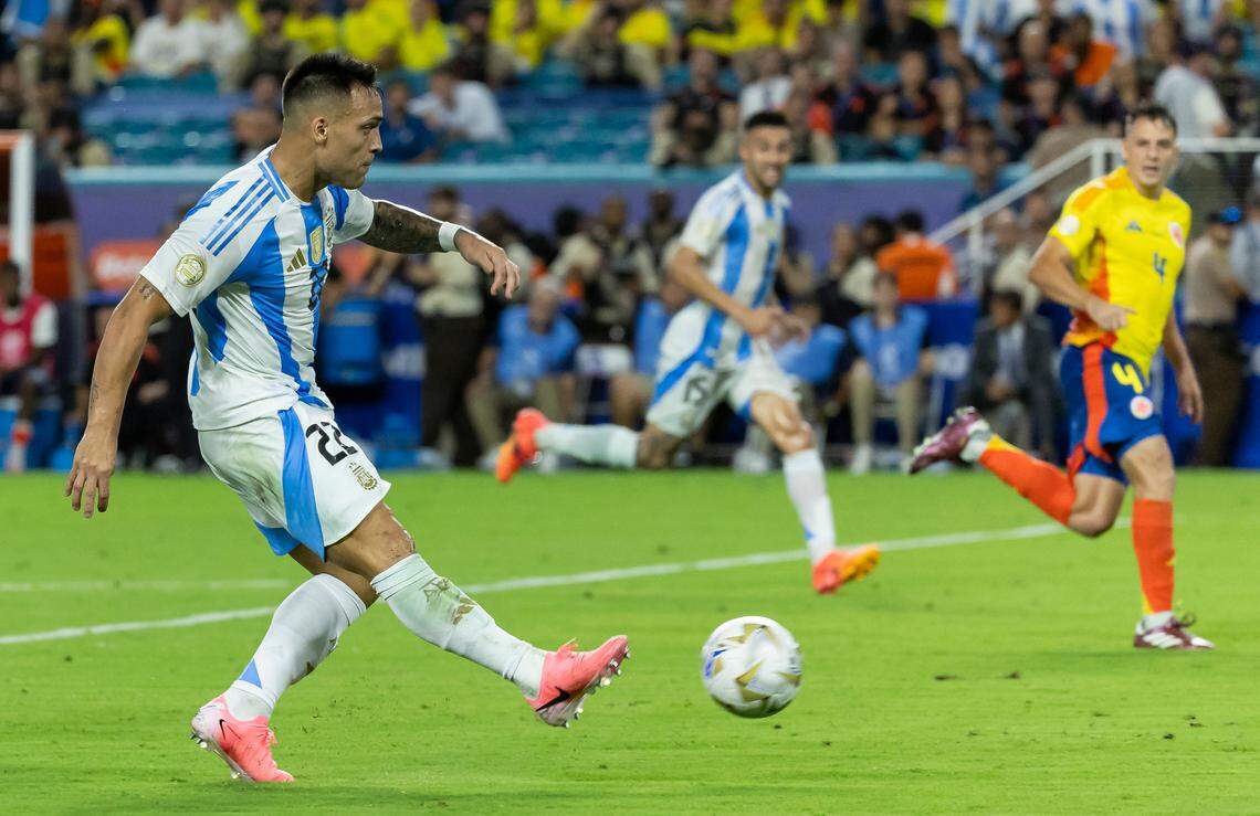 Argentina forward Lautaro Martínez (22) scores a goal against Colombia in extra time of the Copa America 2024 Final soccer match at Hard Rock Stadium on Sunday, July 14, 2024, in Miami Gardens, Fla.