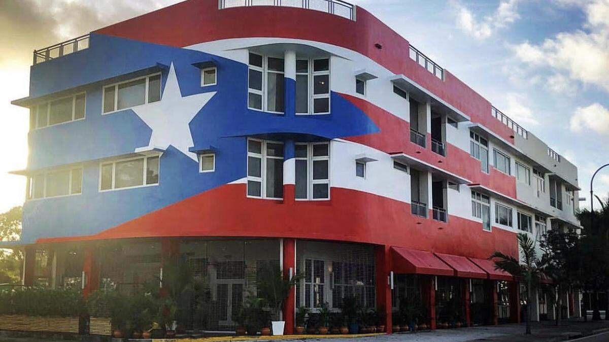 La Placita Puerto Rican restaurant will open New Year’s Day under a controversy. A massive mural covering the three-story building was commissioned without going through a historic board that governs the MiMo area in which it resides.
