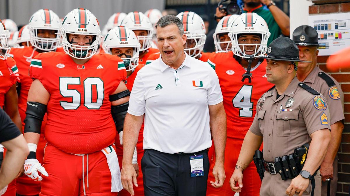 Miami Hurricanes head coach Mario Cristobal heads out to the field for the start of the game against the Georgia Tech Yellow Jackets during an NCAA game at Bobby Dodd Stadium at Hyundai Field in Atlanta, Georgia on Saturday, November 9, 2024.