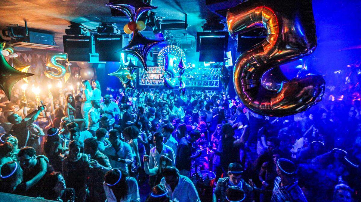 A newly-unearthed photo is said to feature Liberty University President Jerry Falwell, Jr., (center) on the dancefloor at Miami Beach club, Wall, on July 19, 2014, with his son Trey Falwell. World Red Eye founder Seth Browarnik said he found the image, among others, in his company’s vast archive after Falwell Jr. told Politico on Aug. 21, 2019, he was not the man in the photo and that it must have been “photo-shopped.”