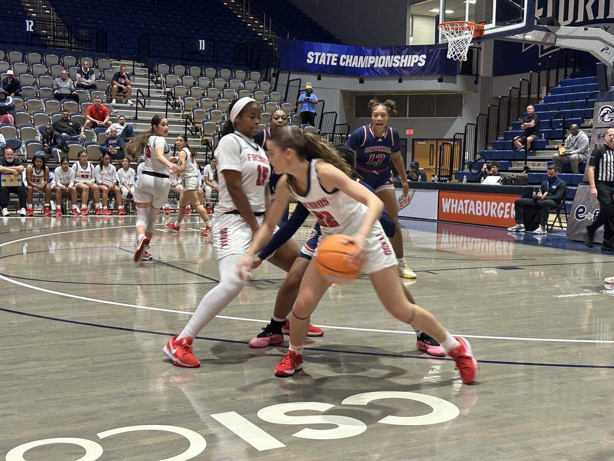 Doral guard Ashley Martinez (22) turns the corner as teammate Karla Stiven (15) sets a screen during Friday’s Class 7A state basketball semifinal against Port St. Lucie Centennial at UNF Arena in Jacksonville, Fla.