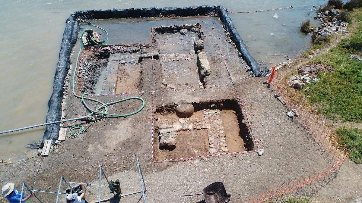A long, narrow building emerged from underwater off the coast of a Greek island, officials said.