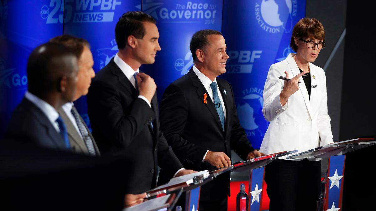 Democratic gubernatorial candidates, from right, Gwen Graham, Philip Levine, Chris King, Jeff Greene and Andrew Gillum await the start of a debate ahead of the Democratic primary for governor on Thursday, Aug. 2, 2018, in Palm Beach Gardens.