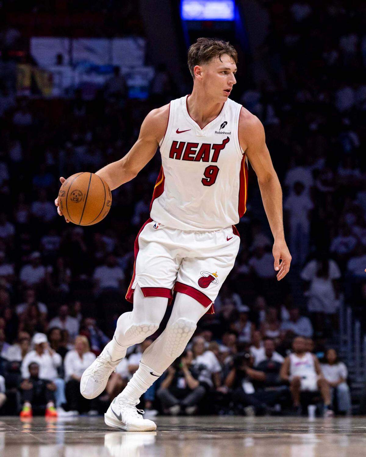 Miami Heat guard Pelle Larsson (9) dribbles the ball during the second half of Game 3 of the NBA Playoffs against the Cleveland Cavaliers at Kaseya Center on Saturday, April 26, 2025, in Miami, Fla.
