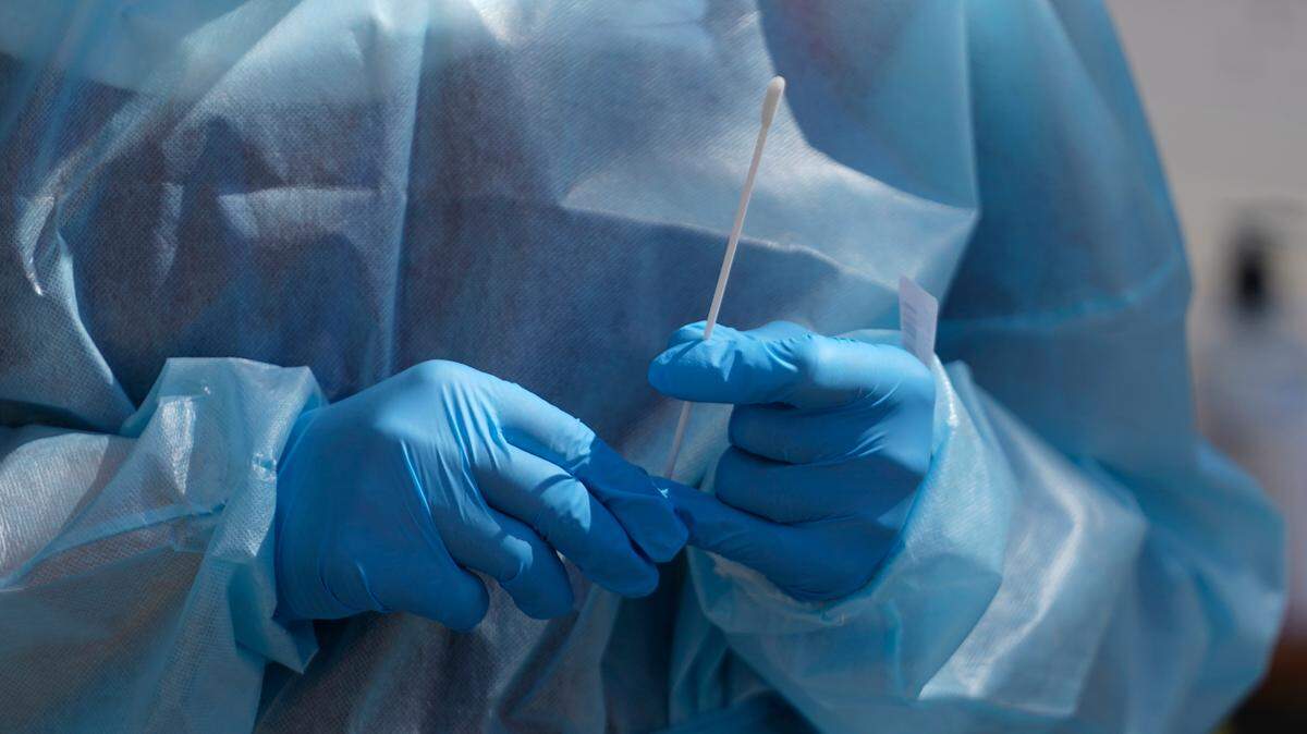 In this stock photo, a nurse gives a COVID-19 test outside the Salt Lake County Health Department Friday, July 22, 2022, in Salt Lake City.