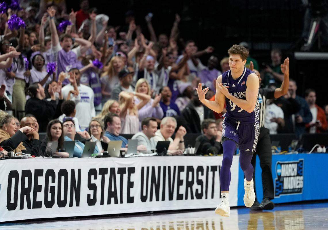 PORTLAND, OREGON - MARCH 19: Chase Johnston #99 of the High Point Panthers celebrates his three-point basket against the Wisconsin Badgers during the second half in the first round of the 2026 NCAA Men's Basketball Tournament at Moda Center on March 19, 2026 in Portland, Oregon. (Photo by Soobum Im/Getty Images)