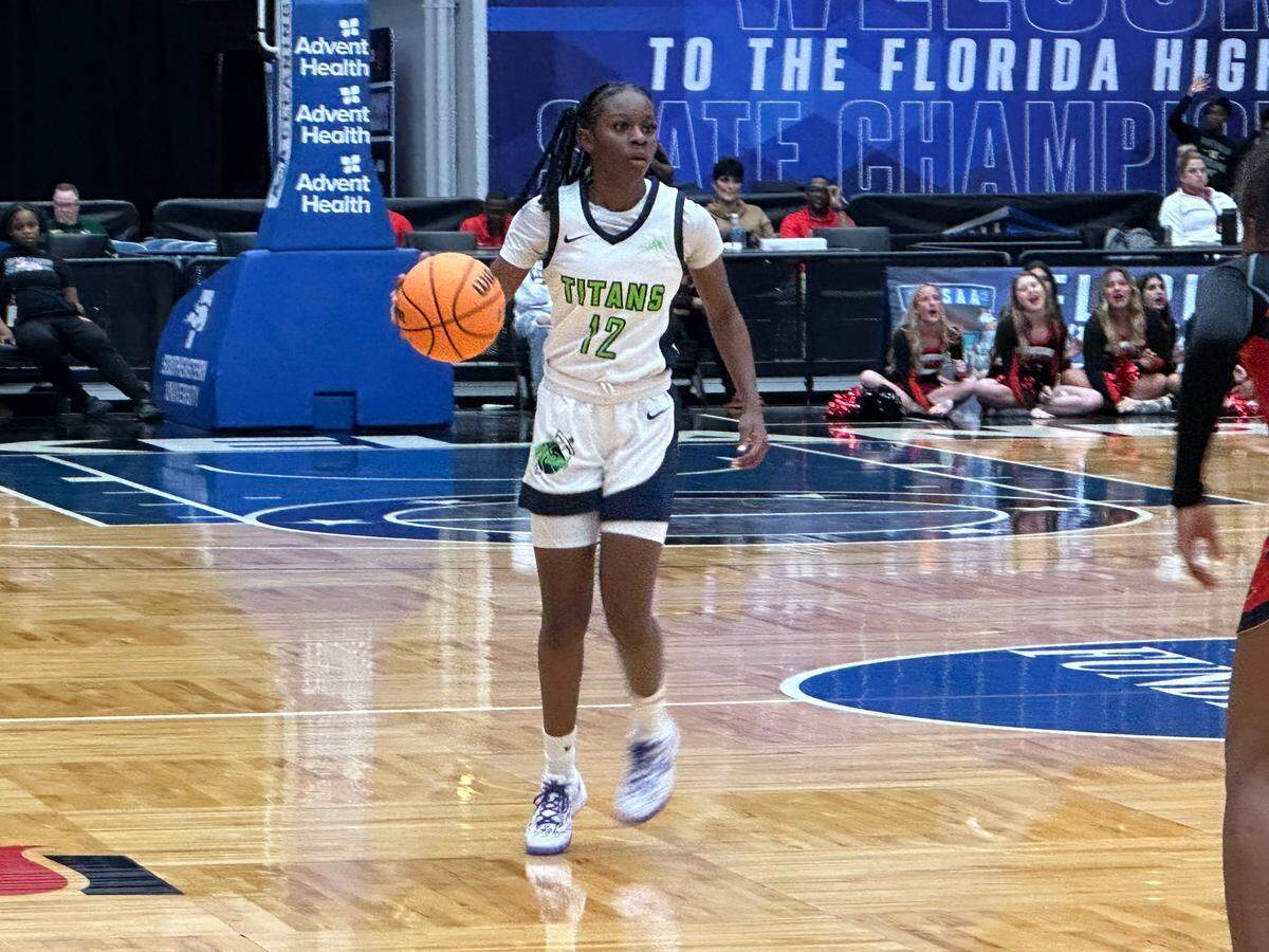 SLAM guard Jim’Miyah Branton runs a play during Thursday’s Class 4A girls basketball state semifinal against Jacksonville Bishop Kenny at the RP Funding Center in Lakeland, Fla.