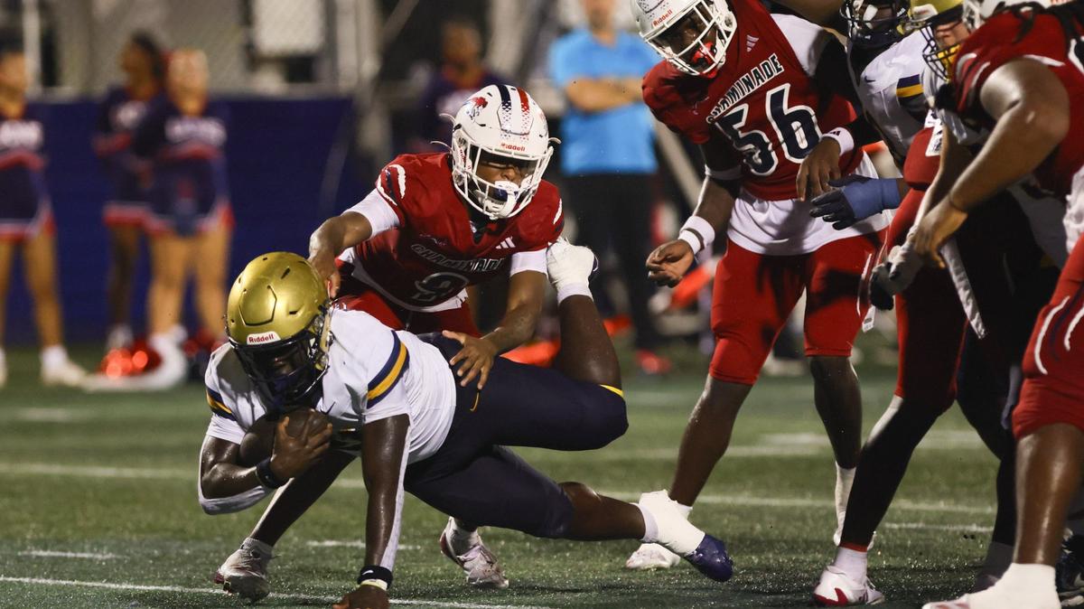 St. Thomas Aquinas Raiders running back Chance Washington (21) scores a touchdown against the Chaminade-Madonna Lions during the second quarter of a high school football game at Pitbull Stadium at Florida International University in Miami, Florida, Friday, October 11, 2024.