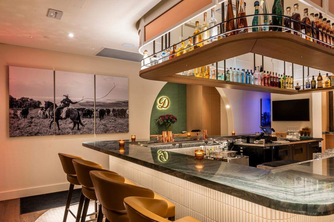 The bar at Daniel’s, with one of the works of Michelle Tricca, a Naples-based phtoographer, celebrating the Florida cowboys. The restaurant aims to source much of its meat from Florida.