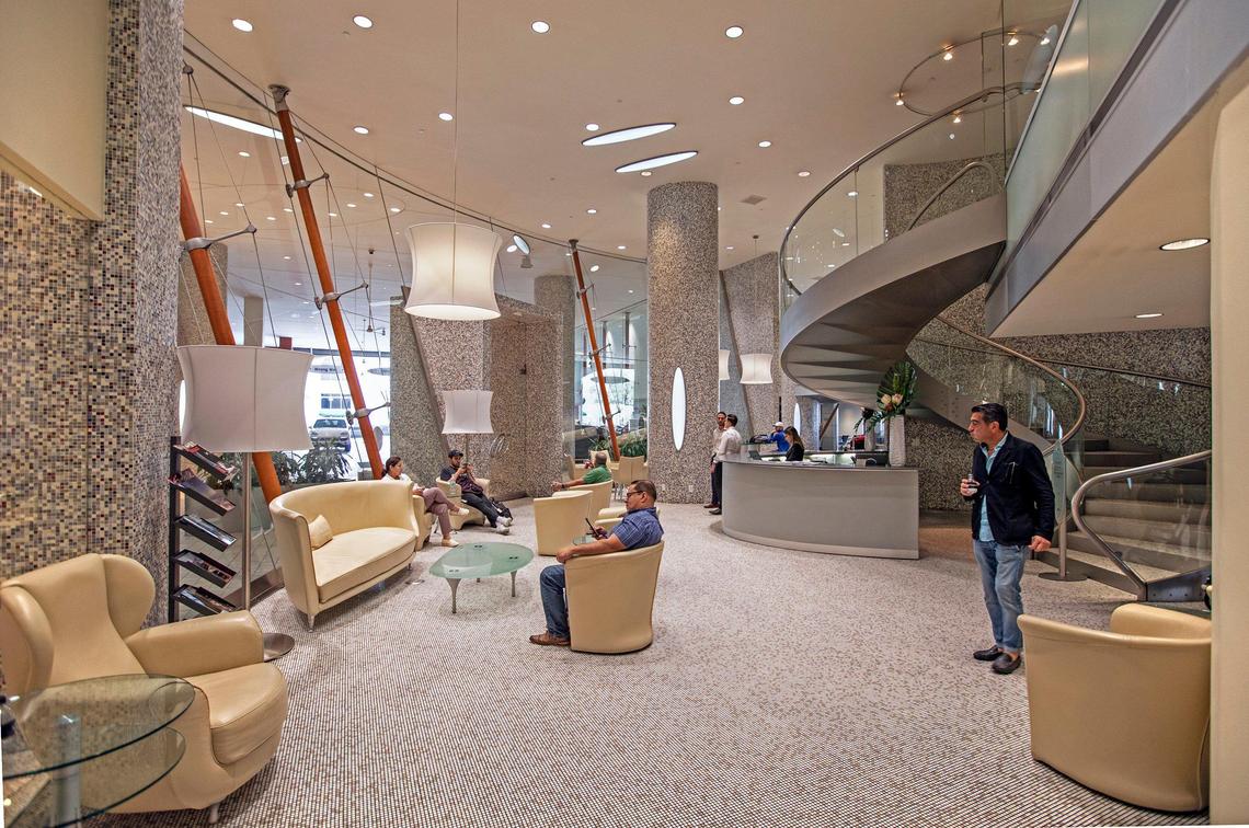 The lounge at The Collection’s opulent flagship dealership in Coral Gables displays an intricate mosaic tile flooring.