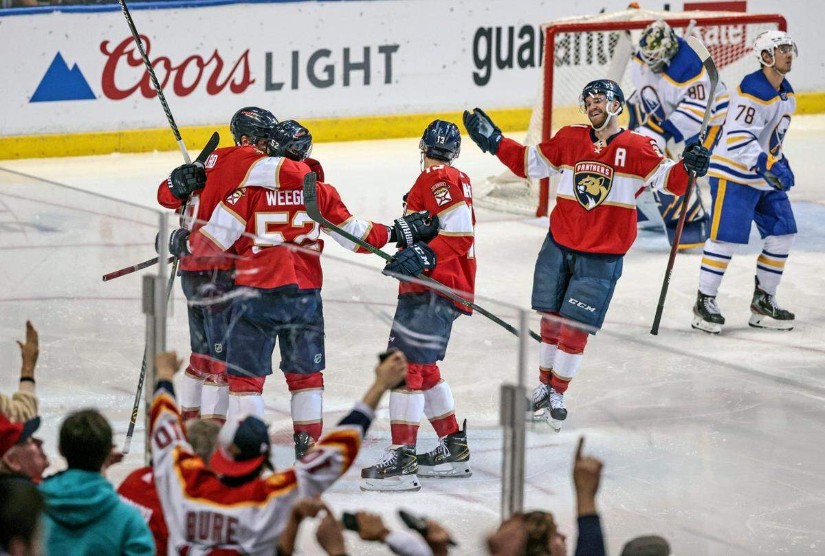 Florida Panthers celebrate defenseman Aaron Ekblad’s goal in the third period against the Buffalo Sabres at the FLA Live Arena in Sunrise on Thursday, Dec. 2, 2021.