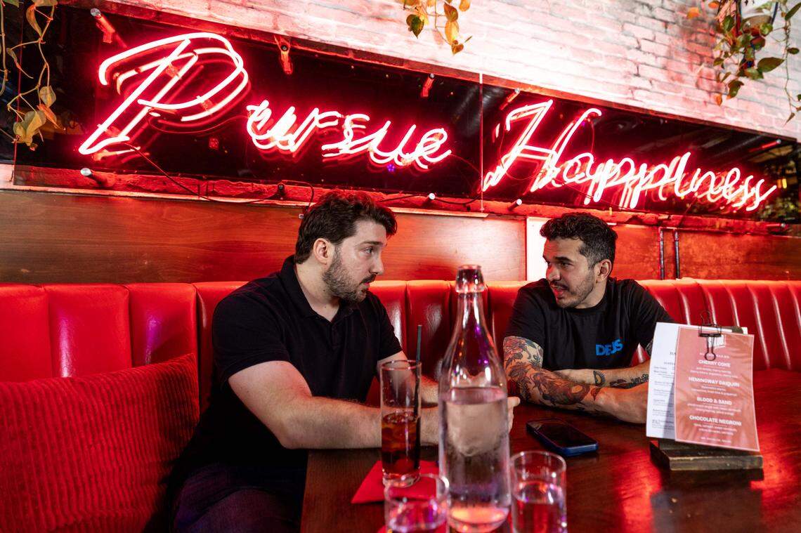 Marcelo Mariel, right, and Flavio Cherem, left, converse at Sweet Liberty on Tuesday, October 8, 2025, in Miami Beach, Fla.