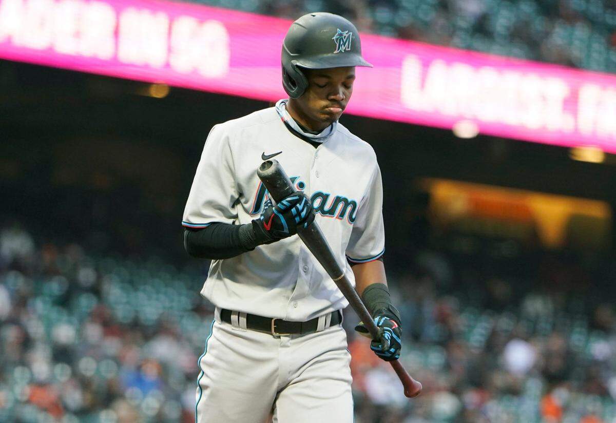 Jose Devers #61 of the Miami Marlins reacts as he walks back to the dugout after striking out against the San Francisco Giants in the fifth inning at Oracle Park on April 24, 2021 in San Francisco, California.