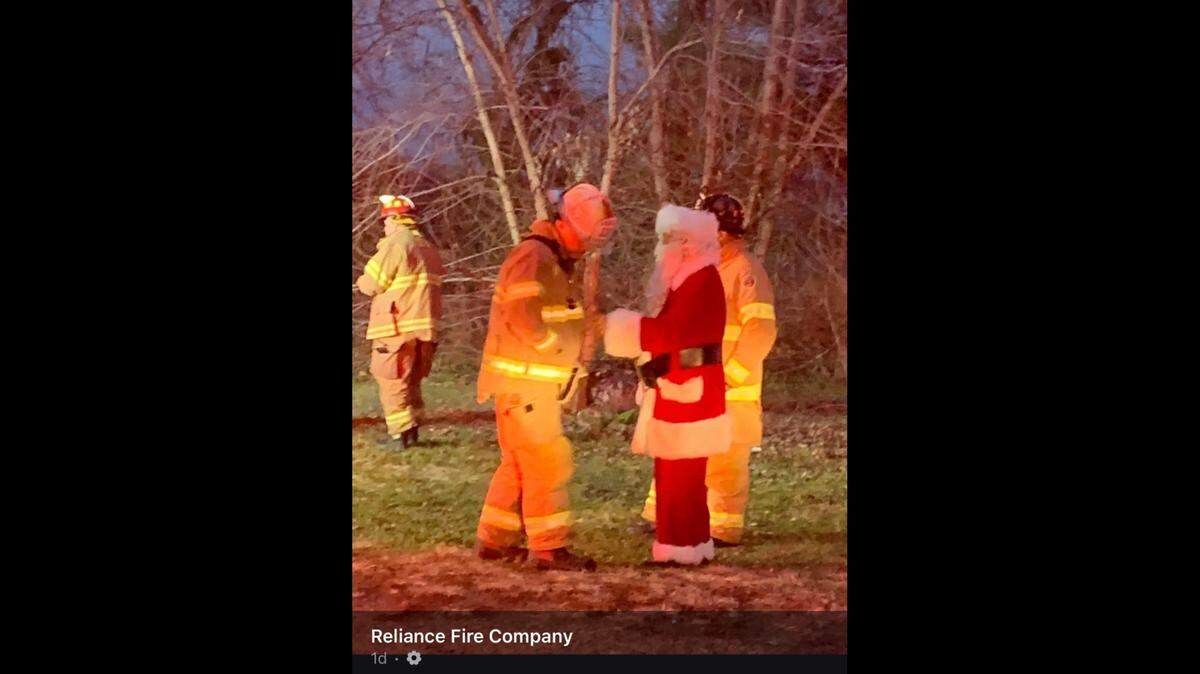 Santa Claus riding with a firetruck crew in Pilesgrove, New Jersey saw a house was burning and saved the family inside, according to the Reliance Fire Company.