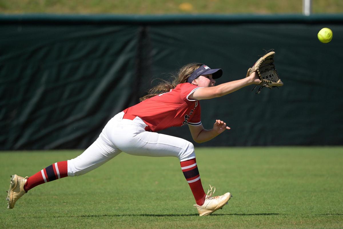 Doral Academy outfielder Gabriella D’archangelo makes a running catch of a lined fly ball by Melbourne’s Addisyn Berry during the fifth inning of an FHSAA State Championship Softball Game, Saturday, May 28, 2022, in Clermont, Fla. (Phelan M. Ebenhack for the Miami Herald)