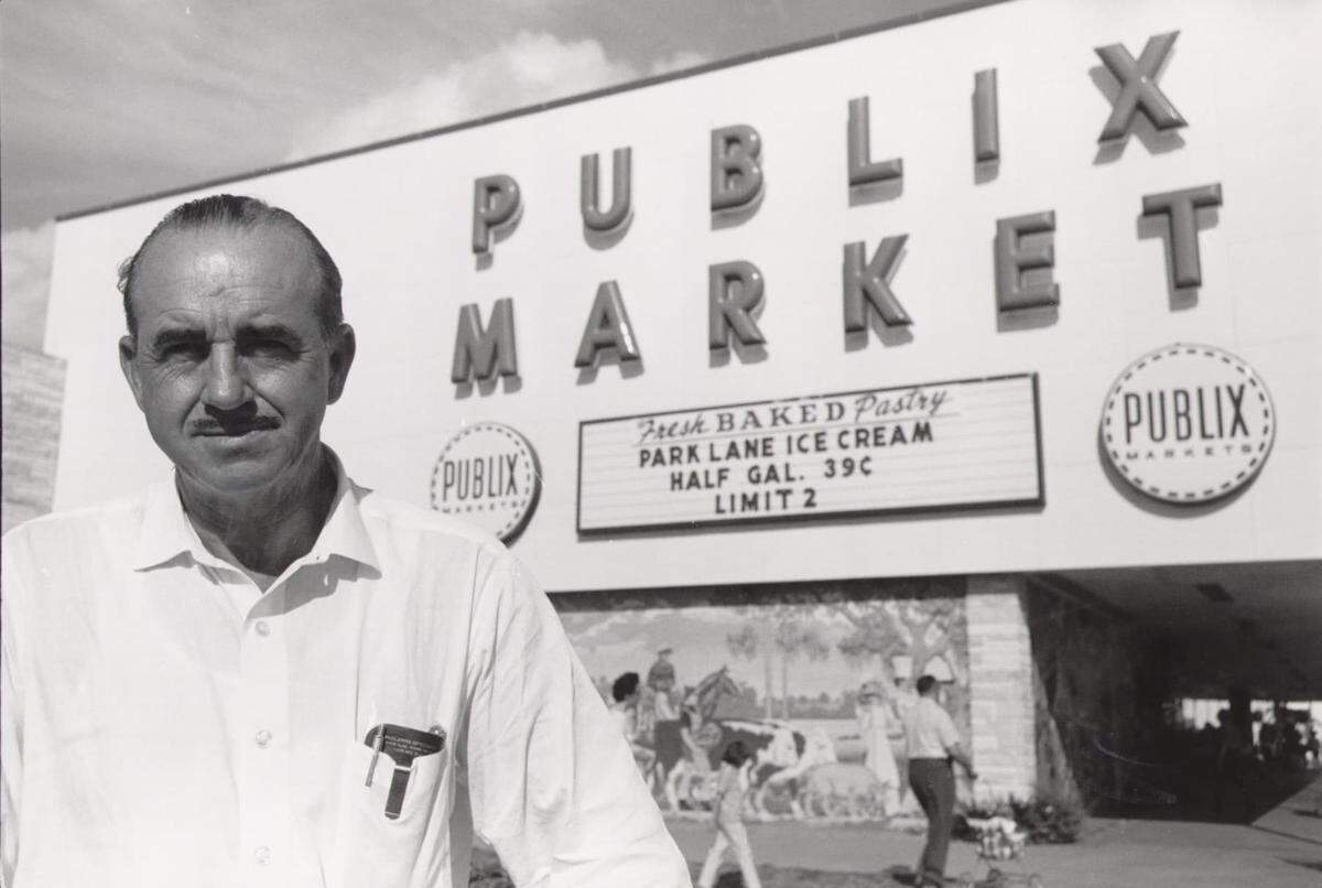 Publix founder George Jenkins in front of one of his Publix Markets in this archive photo provided by Publix. There was a sale on Park Lane Ice Cream for 39 cents for a half gallon placing the date for this photo somewhere in the early 1960s or maybe earlier.