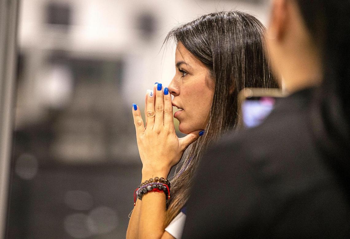 Yanet Leal Concepcion reacts as she waits to reunite with her 6-year-old son, Jorge “JoJo” Morales, at Miami International Airport on Tuesday, Nov. 1, 2022,