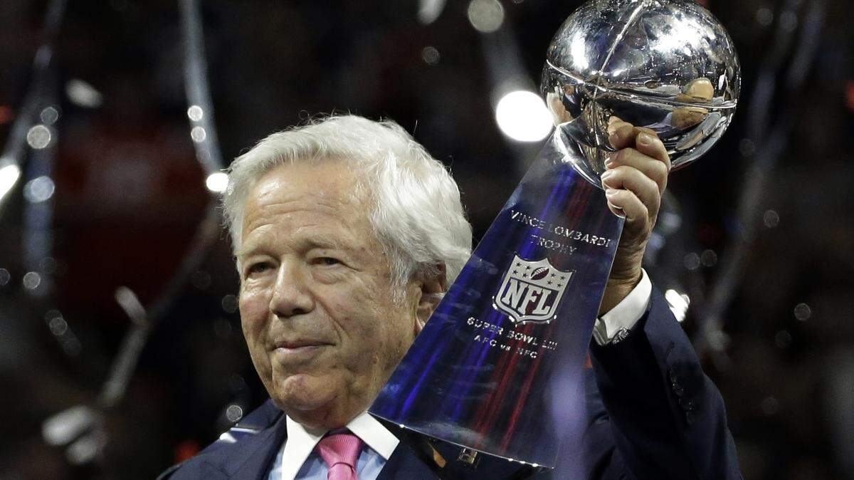 FILE - In this Feb. 3, 2019, file photo, New England Patriots owner Robert Kraft holds the Vince Lombardi trophy after the NFL Super Bowl 53 football game against the Los Angeles Rams, in Atlanta. Police in Florida have charged New England Patriots owner Robert Kraft with misdemeanor solicitation of prostitution, saying they have videotape of him paying for a sex act inside an illicit massage parlor. Jupiter police told reporters Friday, Feb. 22, 2019, that the 77-year-old Kraft has not been arrested. (AP Photo/Mark Humphrey, File)