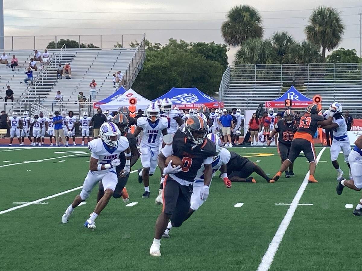 Piper running back Jahnard Young takes off around the right side for a 22-yard first quarter touchdown, Piper’s only score of the day in Thursday’s 31-6 loss to Peachtree Ridge.