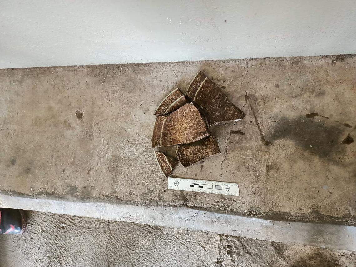 A broken peice of pottery found at the burial site.