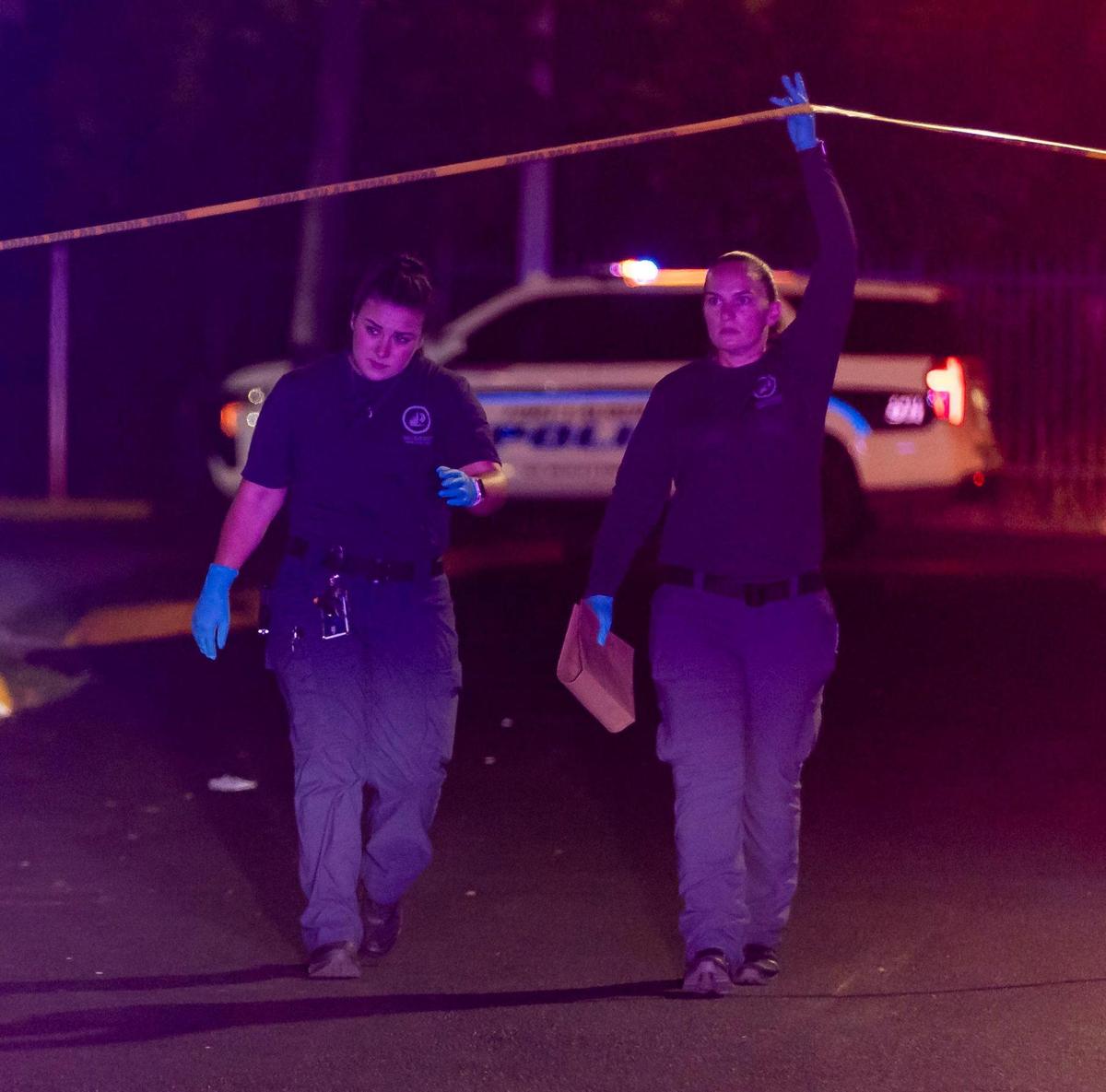 Police work a crime scene near the 2900 block of NW 19th Street on Wednesday, July 5, 2023, in Fort Lauderdale, Fla. Police say five people were transported to the hospital after an altercation between two groups of people ended in gunshots.