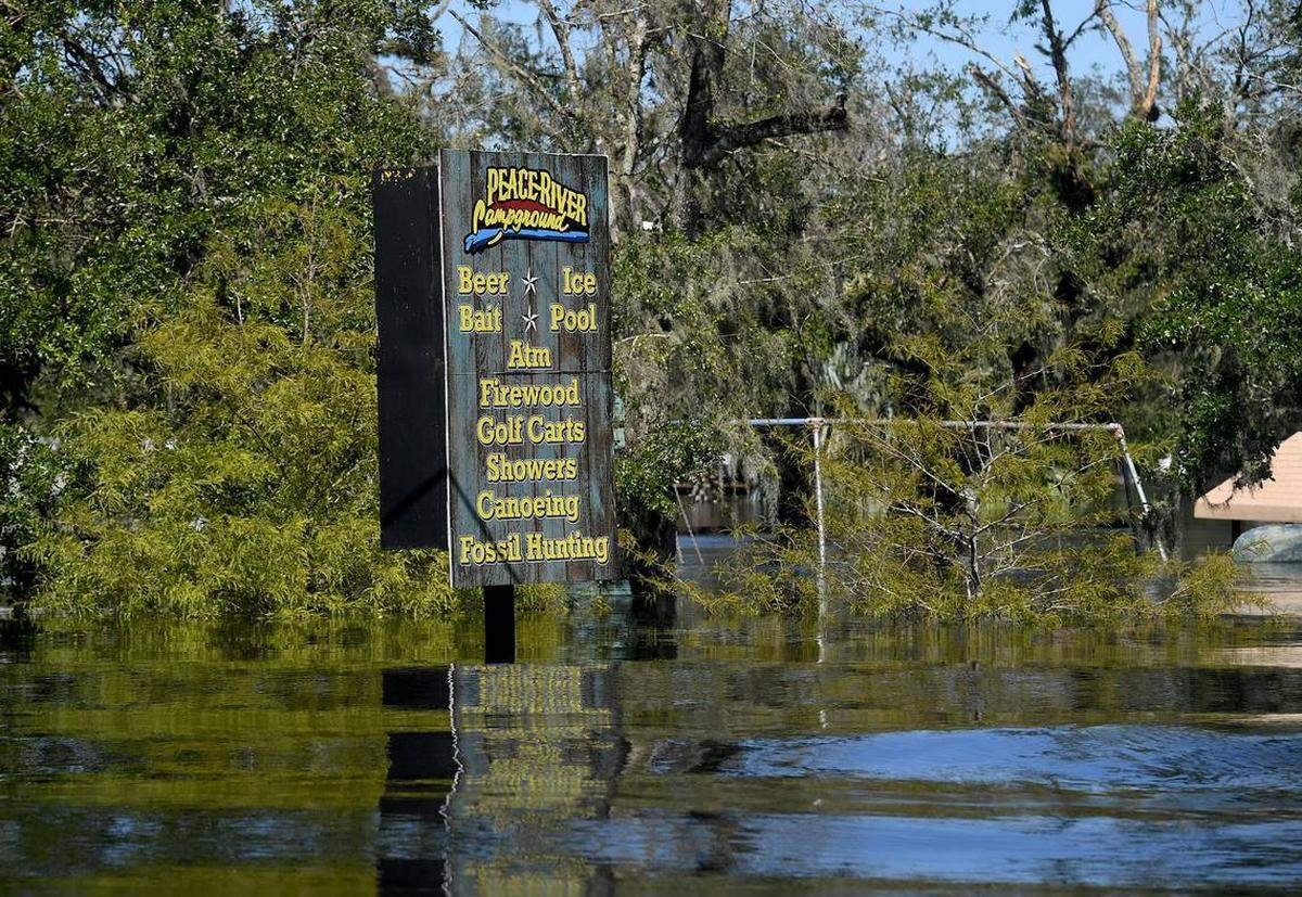 Peace River Campground sign sits in an area flooded by the Peace River in Arcadia on Sept. 30, 2022. The waters receded. The recovery continues.