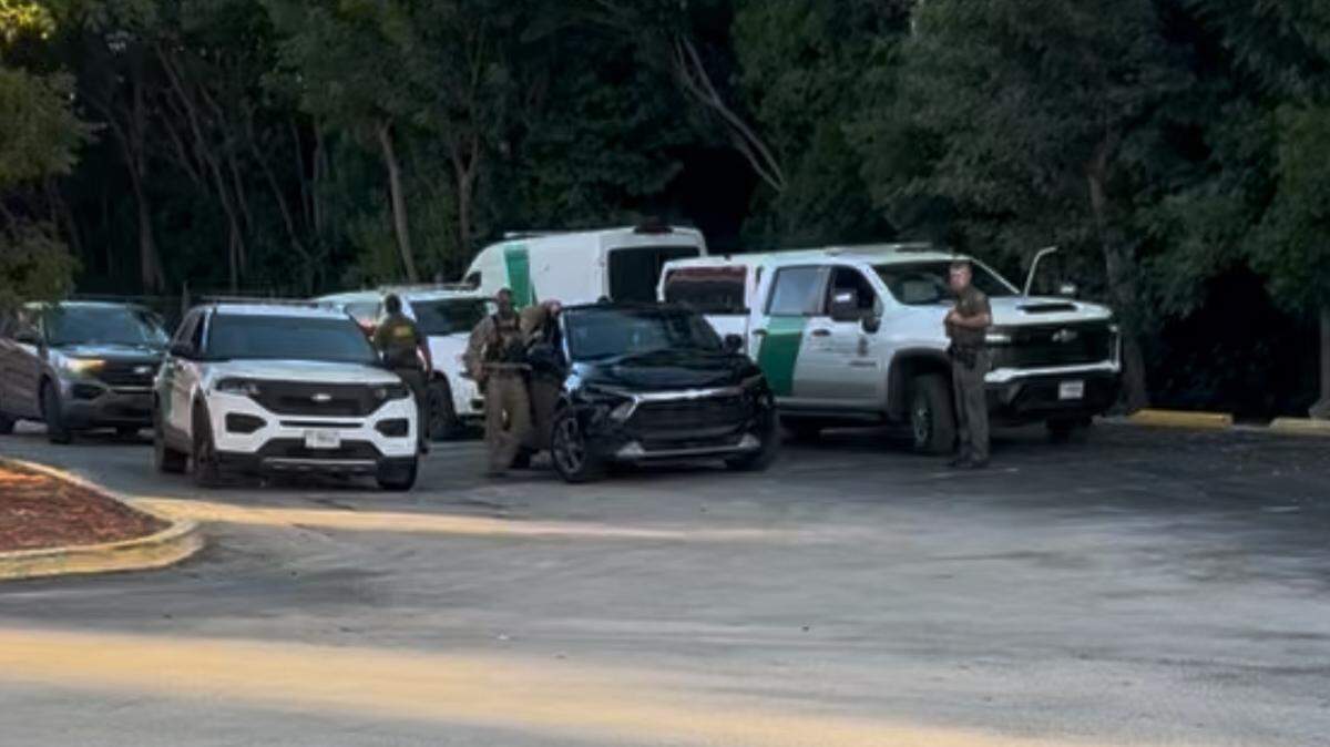 U.S. Border Patrol agents stage for an operation in the Winn Dixie parking lot in Key Largo Friday, Nov. 21, 2025.