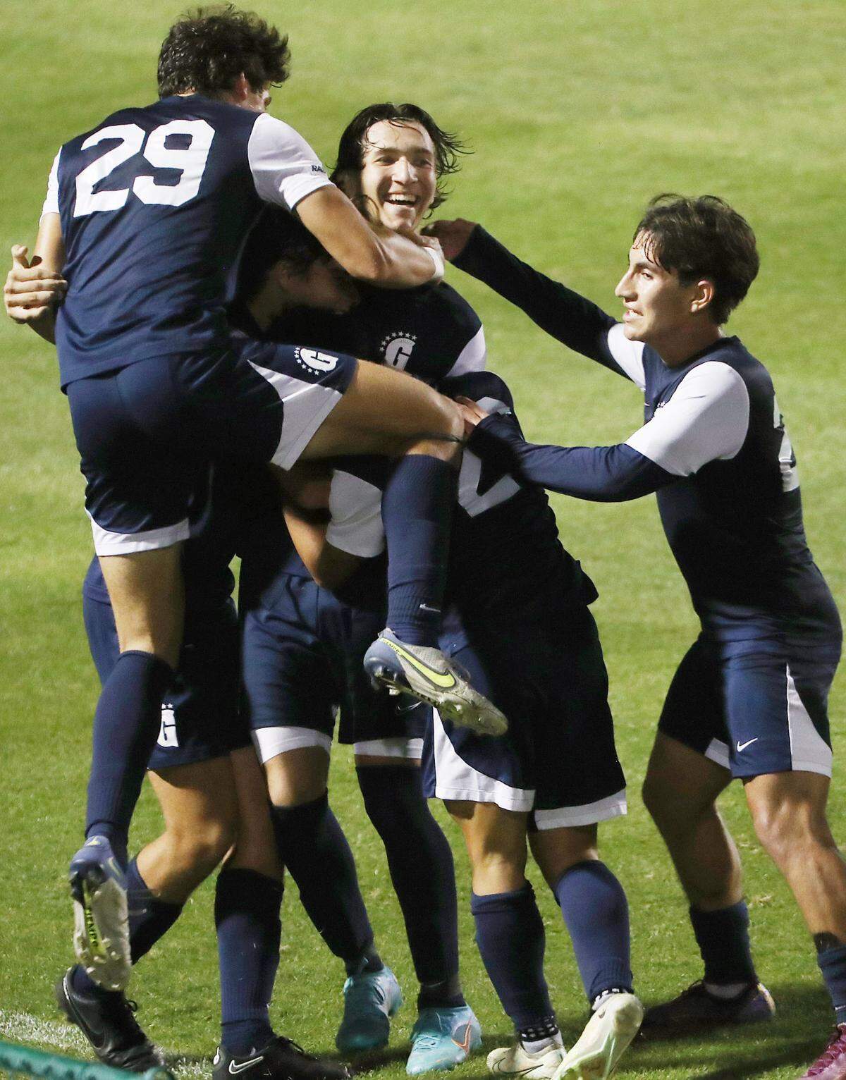 Gulliver players surround player Tomas Sciarra (middle) after he scored a goal during the FHSAA Class 4A state championship game of Bishop Moore Catholic High versus Gulliver Prep at Spec Martin Stadium in DeLand on Thursday, February 23, 2023. Gulliver Prep won won the match to claim the state championship. (Stephen M. Dowell/Orlando Sentinel)