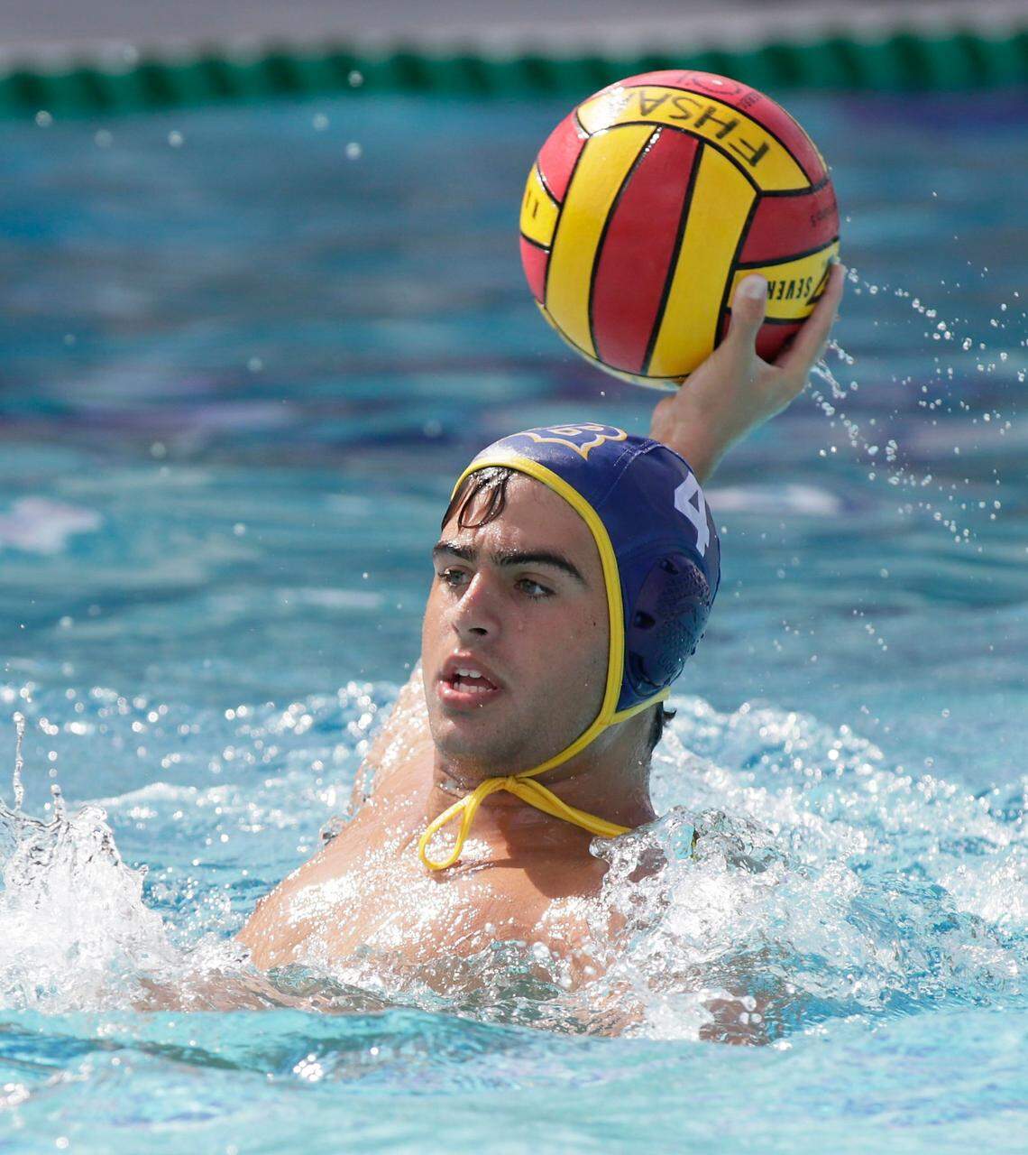 Belen Jesuit’s Zachary Callejas goes for a shot against Orlando’s Dr. Phillips during the State Water Polo Boys final game on Saturday, April 23, 2022 in Miami. Andrew Uloza / for THE MIAMI HERALD