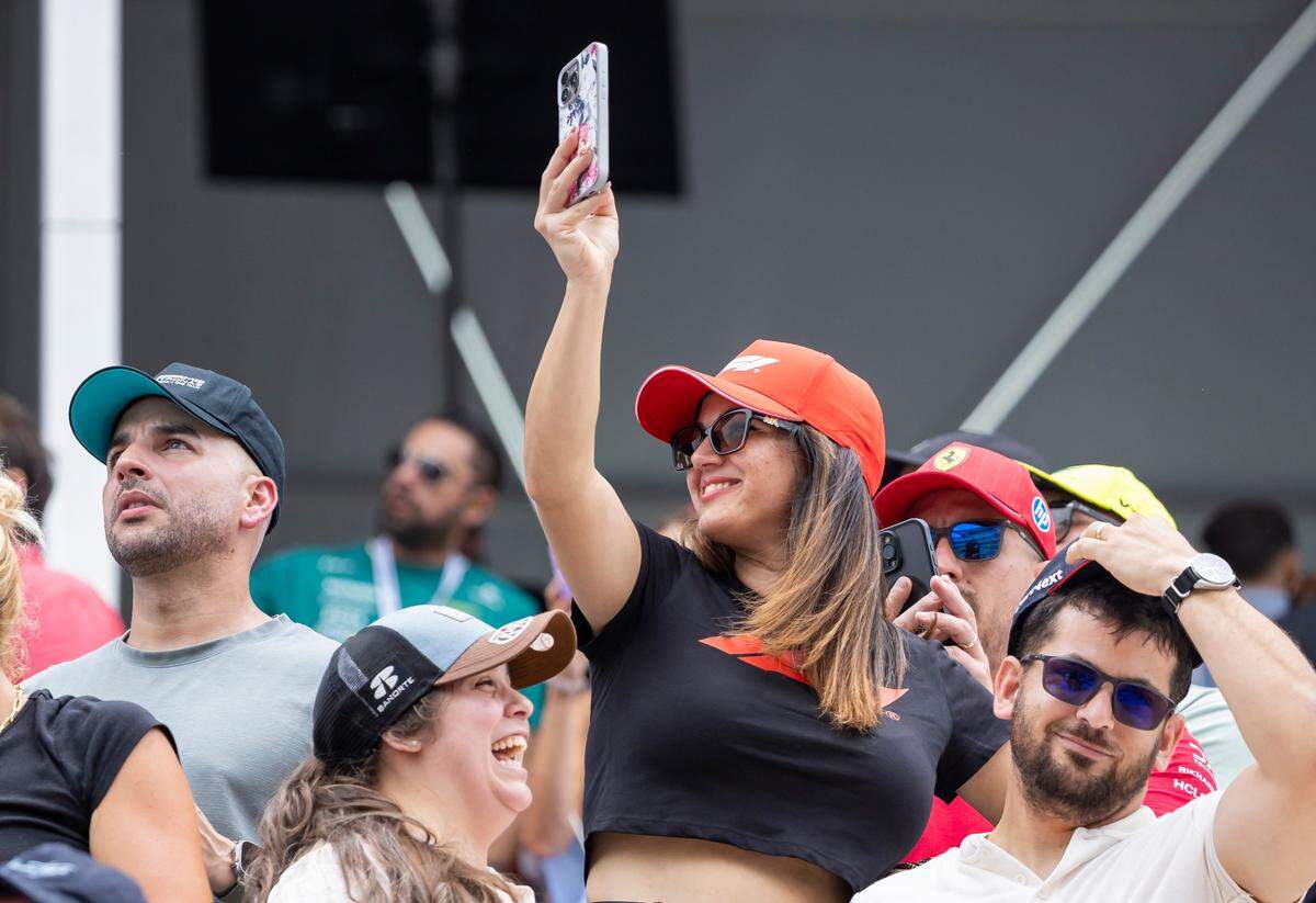 Fans react as they watch drivers participate in a Sprint race on the second day of the Formula One Miami Grand Prix at the Miami International Autodrome on Saturday, May 3, 2025, in Miami Gardens, Fla.