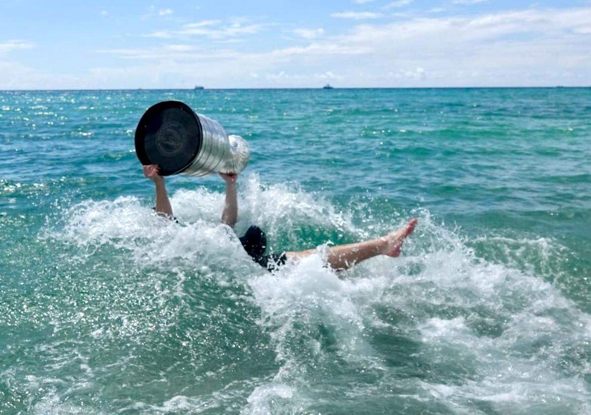 The Florida Panthers’ Matthew Tkachuk celebrates winning the Stanley Cup in the Atlantic Ocean near the Elbo Room in Fort Lauderdale on Tuesday, June 25, 2024.