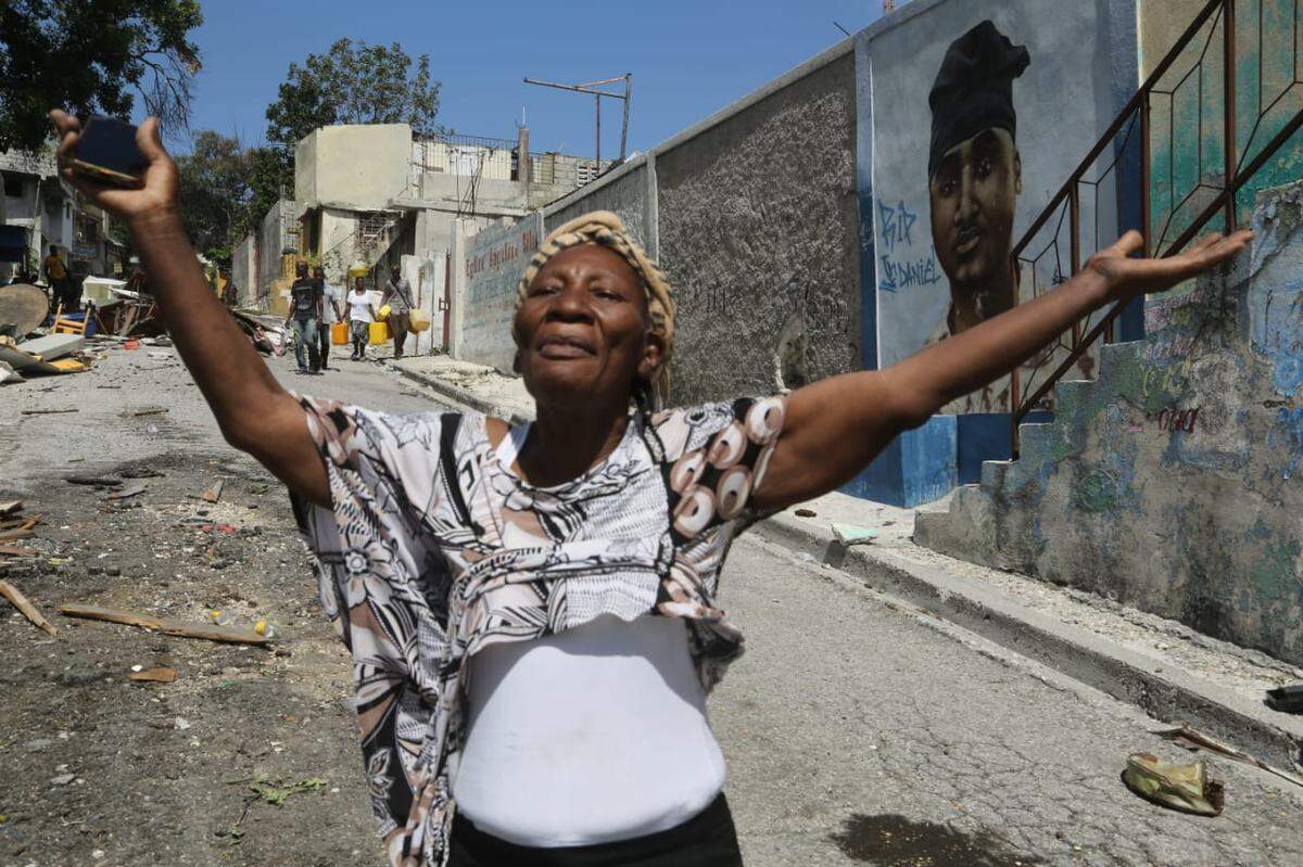 Rose Marie Michel, 73, finds that gangs have flattened her home in Delmas 30 after she visits to see if she can return. She has lived in the Port-au-Prince neighborhood since 1974.