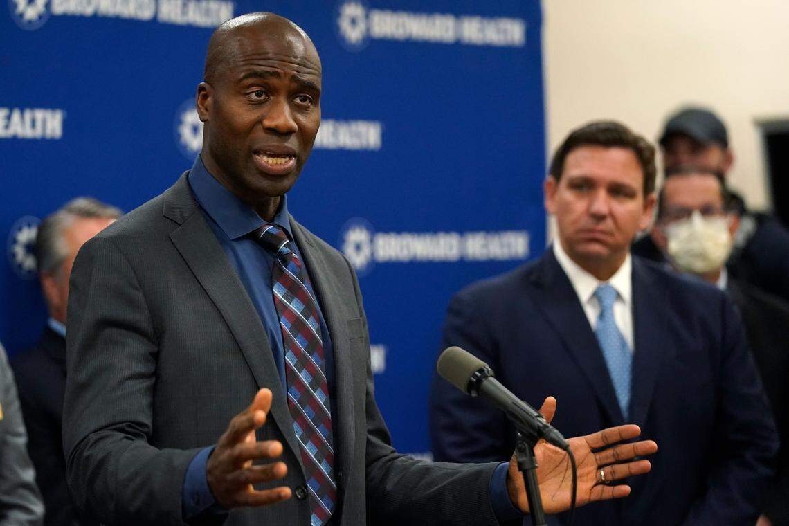 Florida Surgeon General Dr. Joseph A. Ladapo, left, speaks at a news conference with Florida’s Gov. DeSantis in January at Broward Health Medical Center.