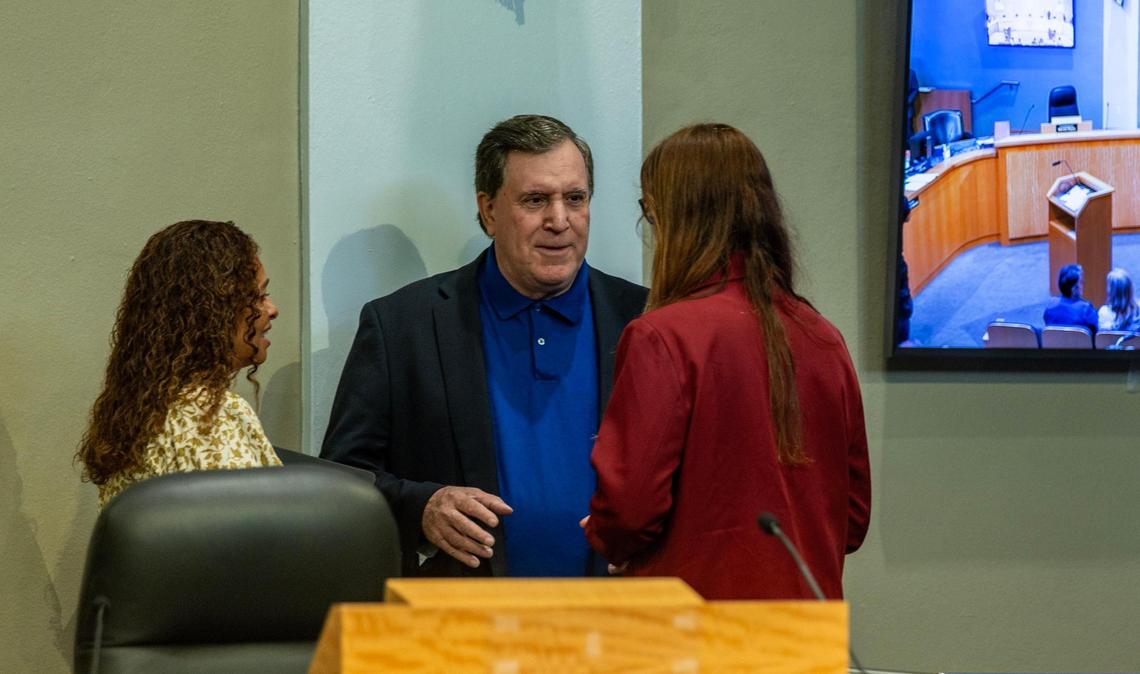 Miami Commission Chairwoman Christine King, Vice Chairman Joe Carollo and Commissioner Sabina Covo converse before the meeting to decide how to fill the seat left vacant after a colleague’s corruption arrest.