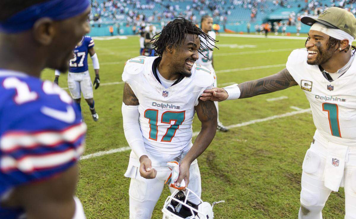 Miami Dolphins wide receiver Jaylen Waddle (17) and quarterback Tua Tagovailoa (1) react on the field after they defeated the Buffalo Bills in their NFL game at Hard Rock Stadium on Sunday, Nov. 9, 2025, in Miami Gardens, Fla.