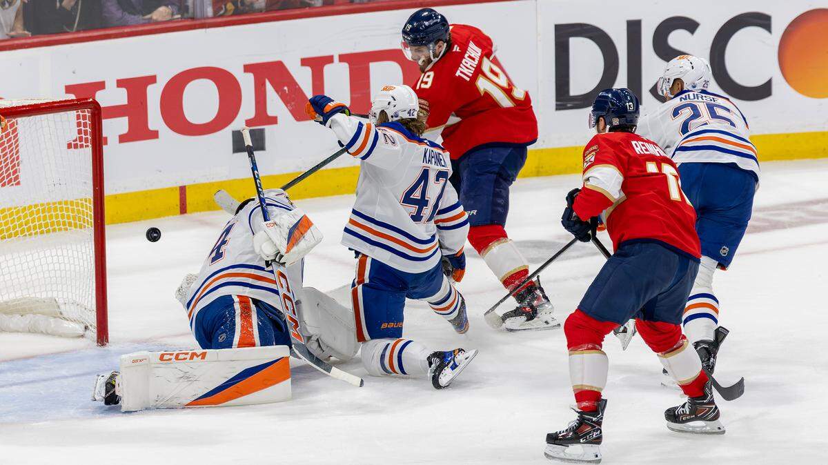 Florida Panthers left wing Matthew Tkachuk (19) fires a shot past Edmonton Oilers goaltender Stuart Skinner (74) to score during the first period of Game 4 in the NHL Stanley Cup Final at Amerant Bank Arena on Thursday, June 12, 2025, in Sunrise, Fla.