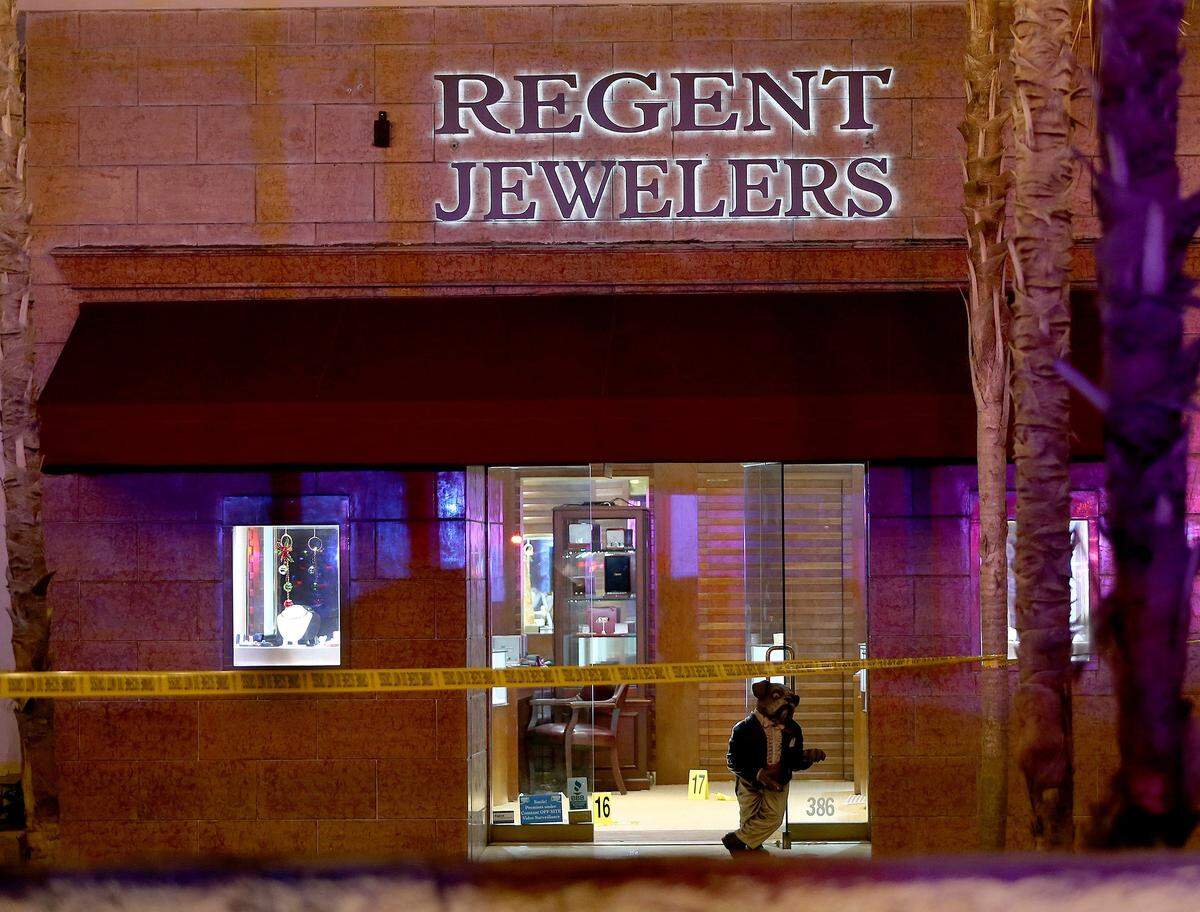 Yellow tape blocks the access to the sidewalk after a robbery at Regent Jewelers at 386 Miracle Mile  in Coral Gables on Dec. 5, 2019.  The shootout in Broward County - that left a UPS driver and bystander dead - began with a bungled robbery attempt at Regent Jewelers. The robbers carjacked the UPS truck in the Gables - with the driver in it - and fled into Broward, where multiple police agencies engaged in a shootout amid rush-hour traffic.